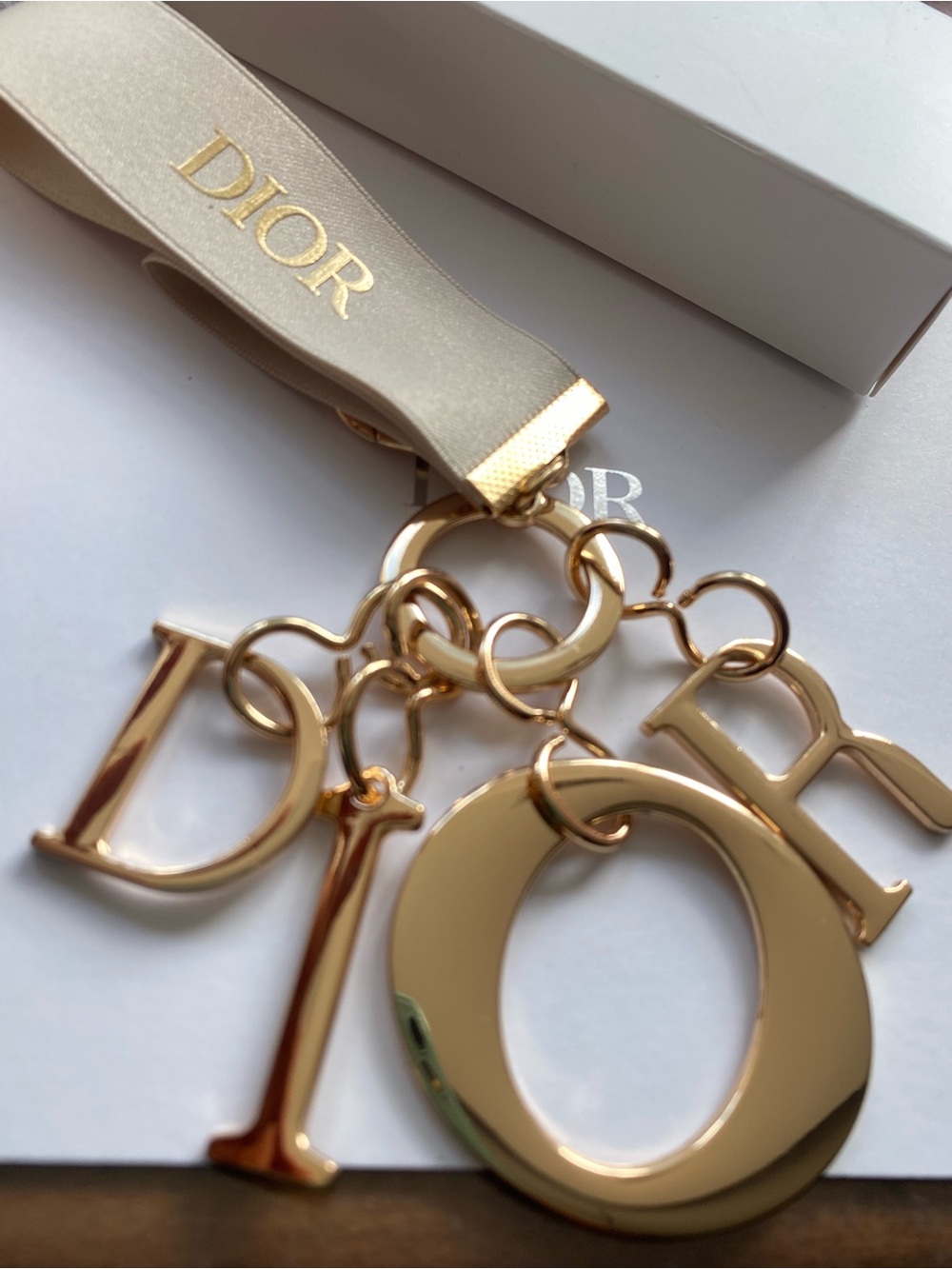 Unbranded  Gold keychain Logo Charm Keyring with Cream Ribbon